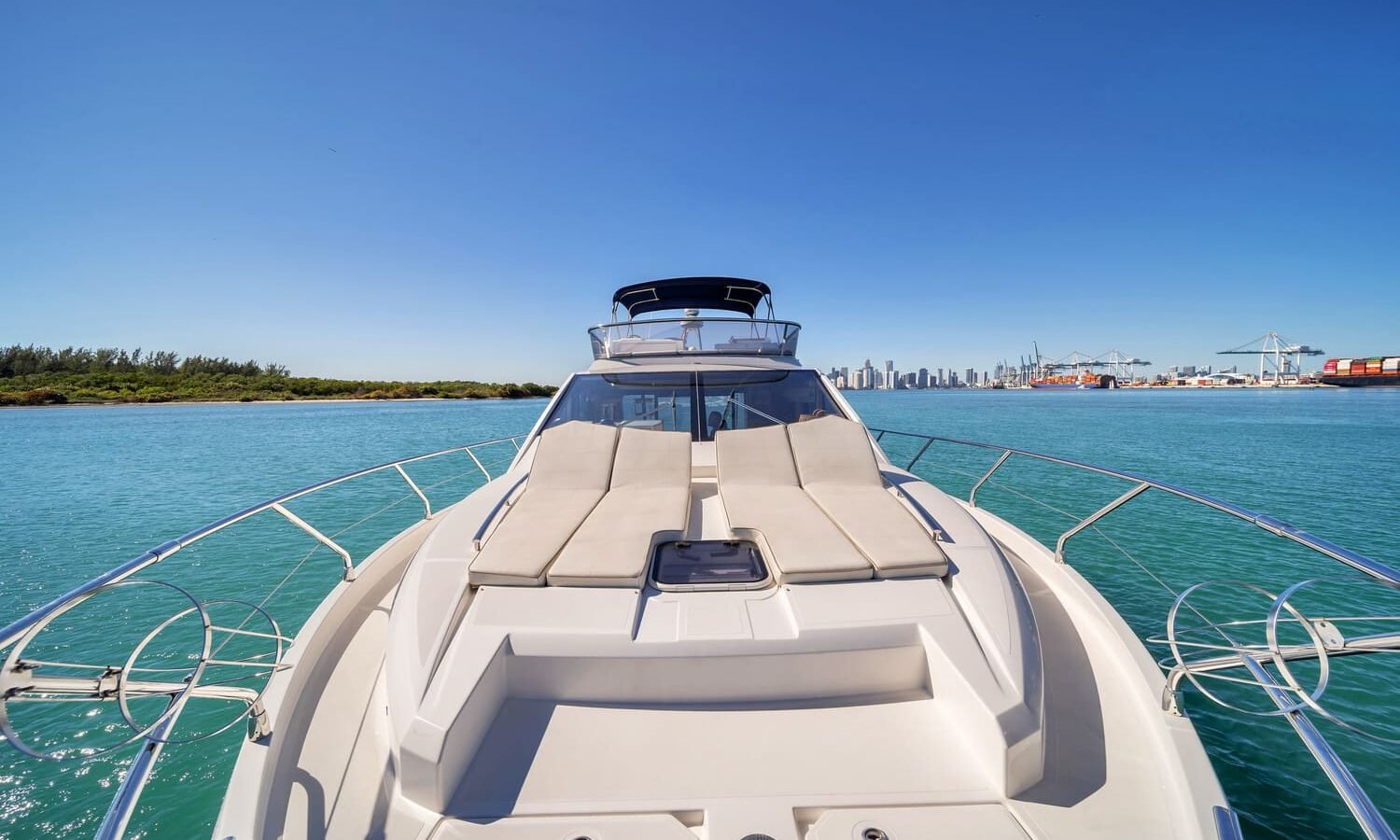 Front deck of the 60' ABSOLUTE FLY yacht, offering a perfect space for sunbathing and relaxation.