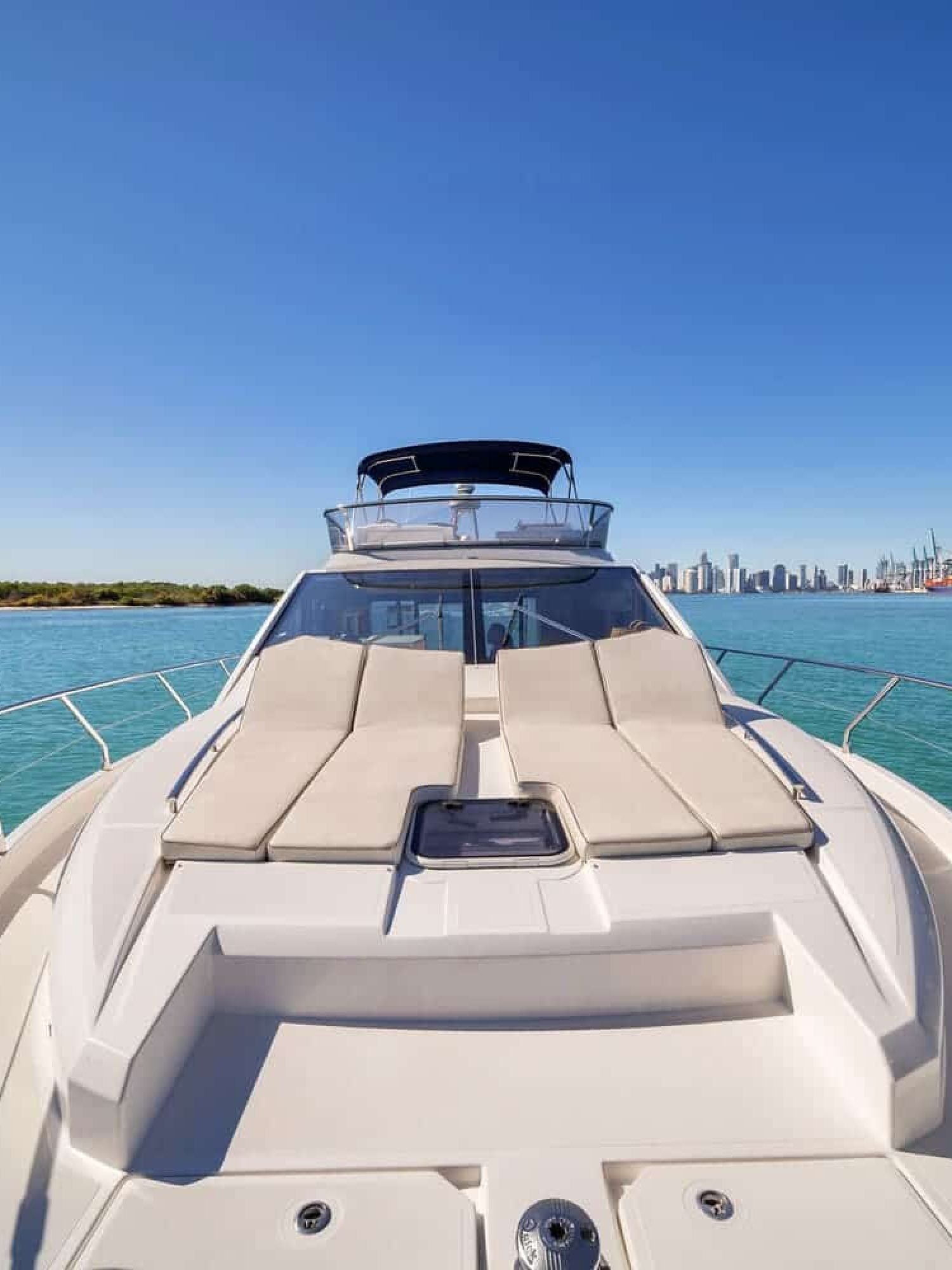 Front deck of the 60' ABSOLUTE FLY yacht, offering a perfect space for sunbathing and relaxation.