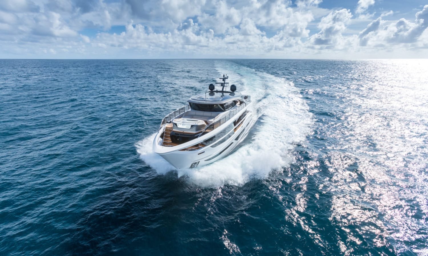 The 100' PRINCESS X95 yacht cruising at sea, showcasing its elegant exterior design.