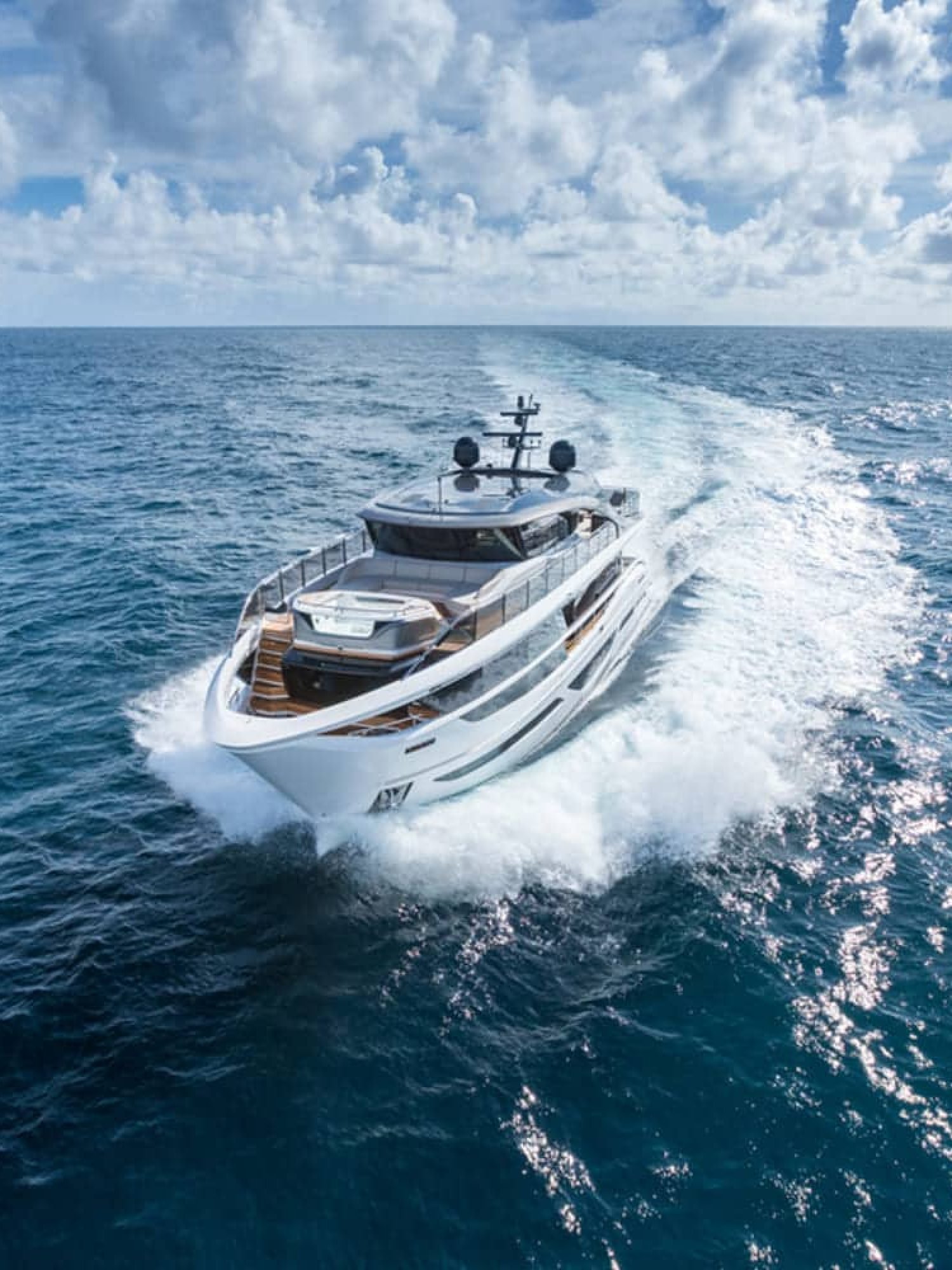 The 100' PRINCESS X95 yacht cruising at sea, showcasing its elegant exterior design.