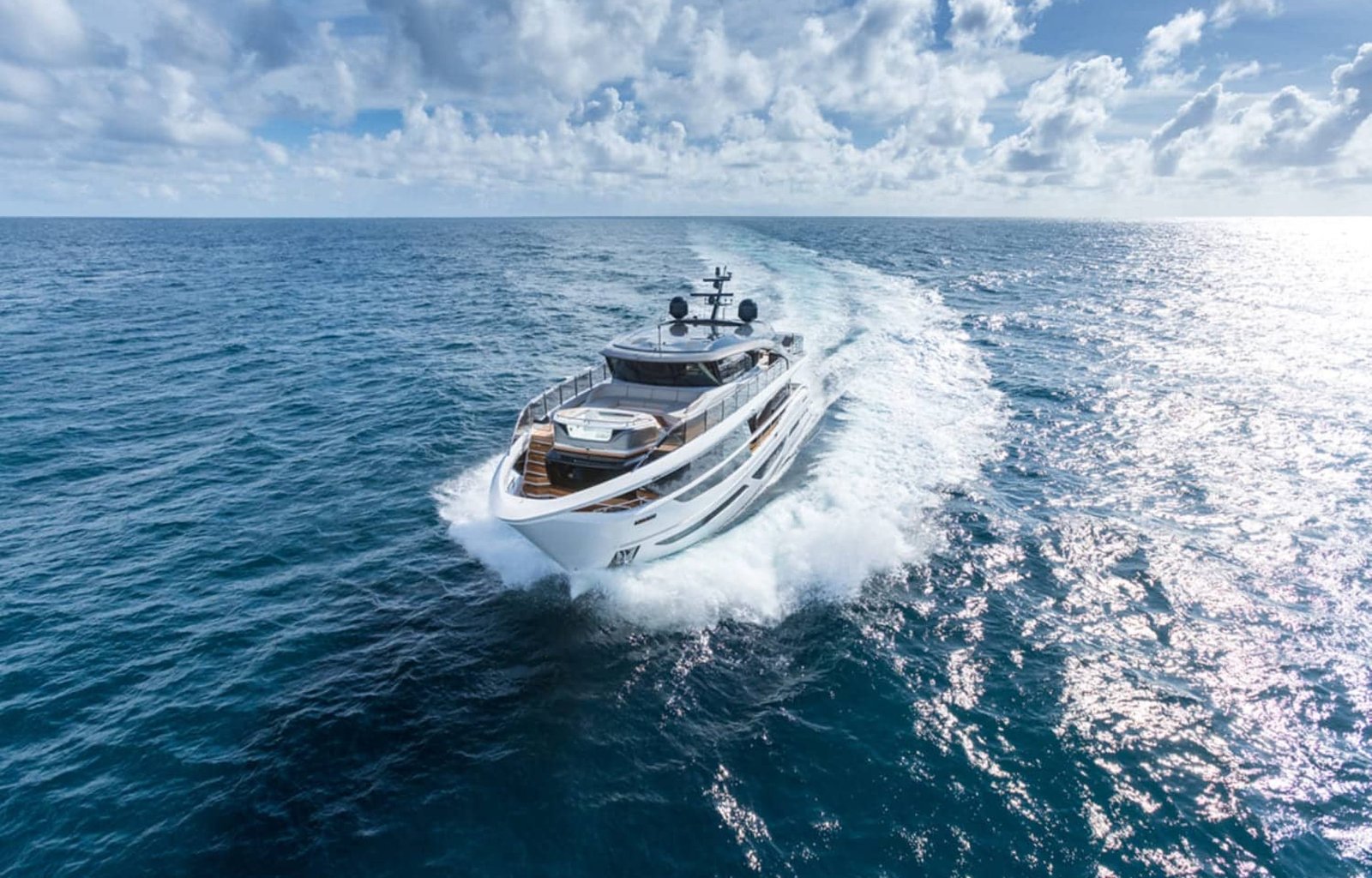The 100' PRINCESS X95 yacht cruising at sea, showcasing its elegant exterior design.