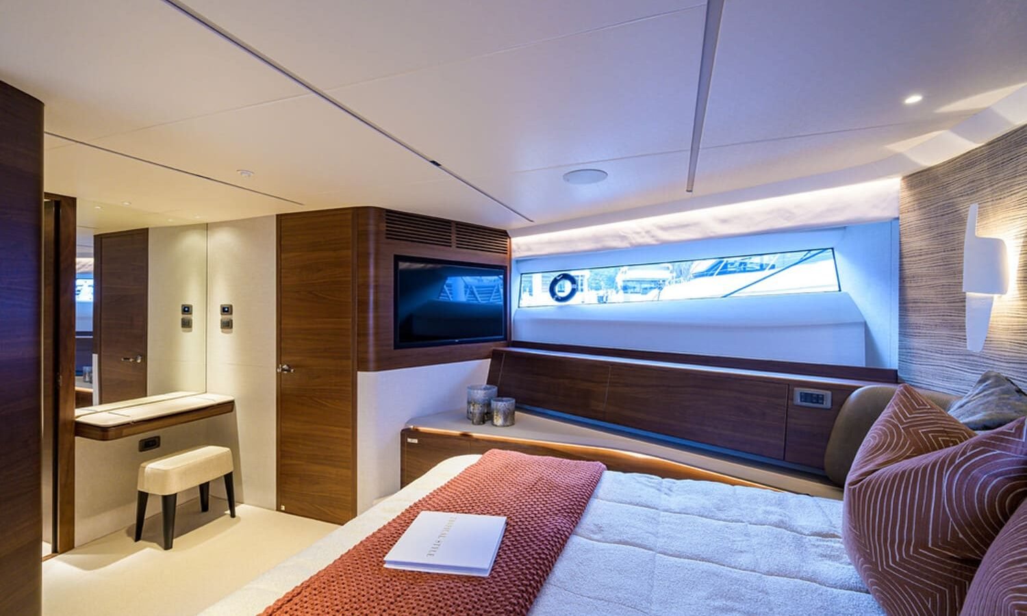 A serene view of the spacious bedroom on the 100' PRINCESS X95 yacht, designed for ultimate comfort.