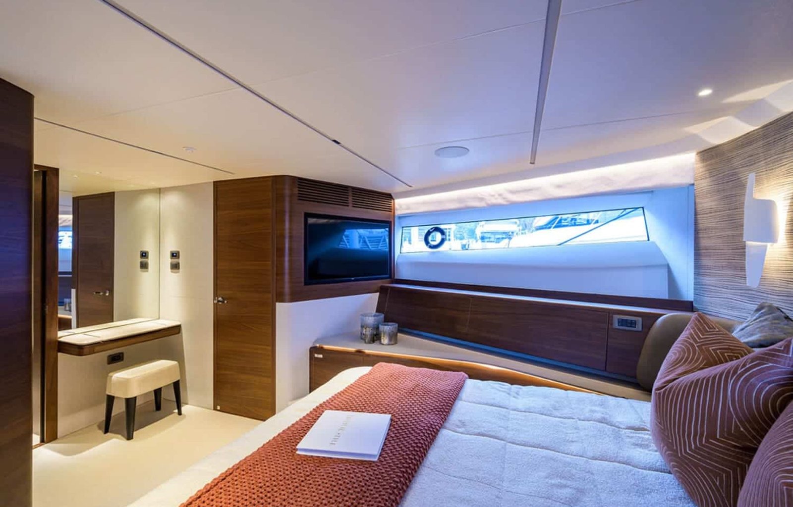 A serene view of the spacious bedroom on the 100' PRINCESS X95 yacht, designed for ultimate comfort.
