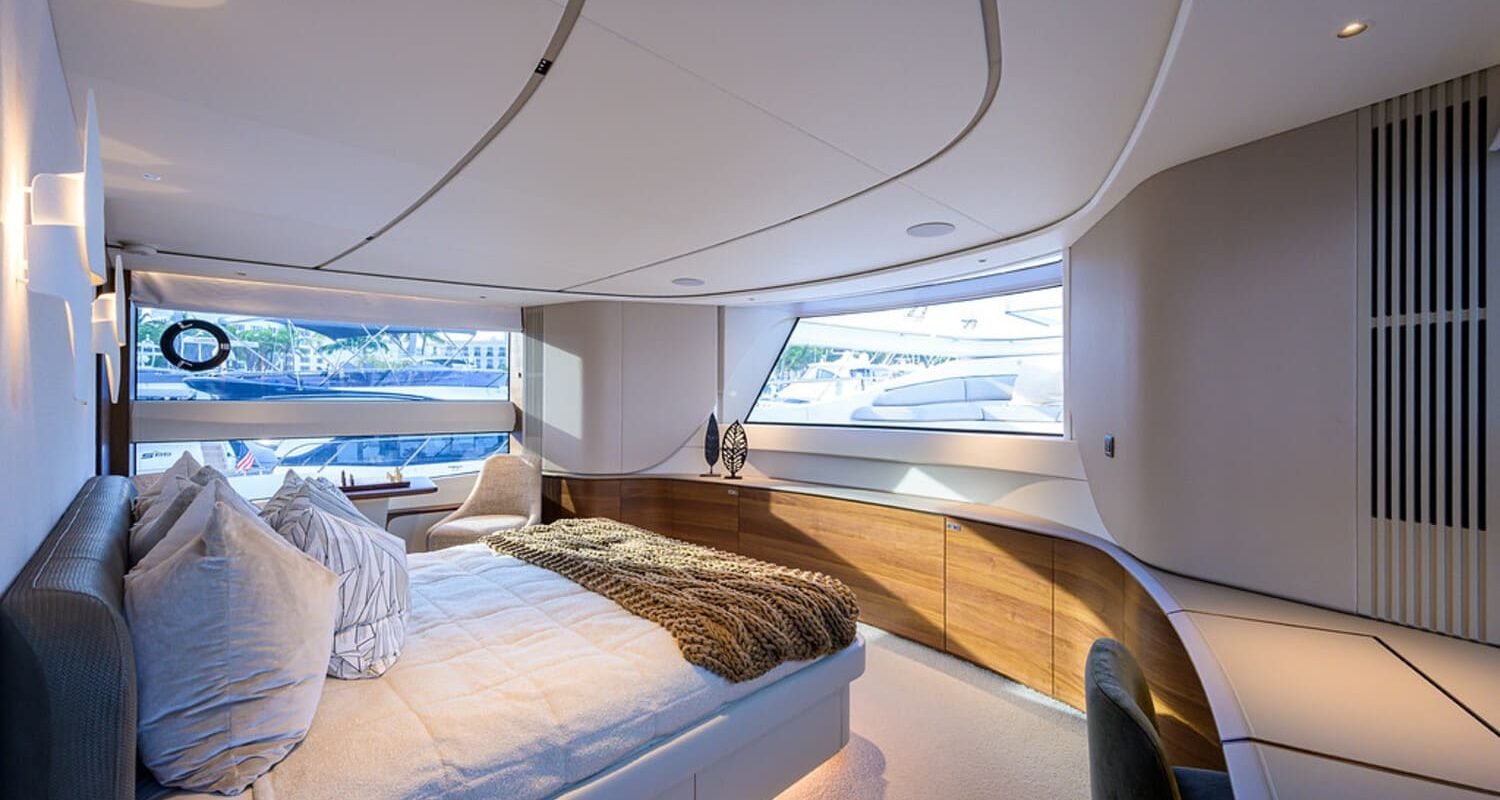 Another angle of the spacious and luxurious bedroom in the 100' PRINCESS X95 yacht, offering ultimate relaxation.