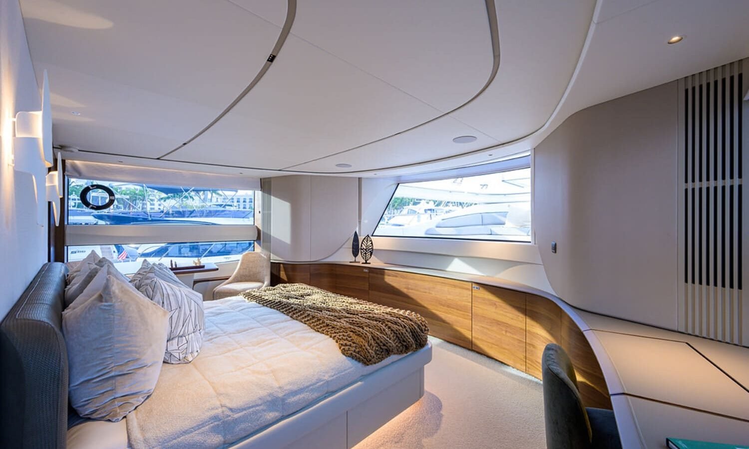 Another angle of the spacious and luxurious bedroom in the 100' PRINCESS X95 yacht, offering ultimate relaxation.