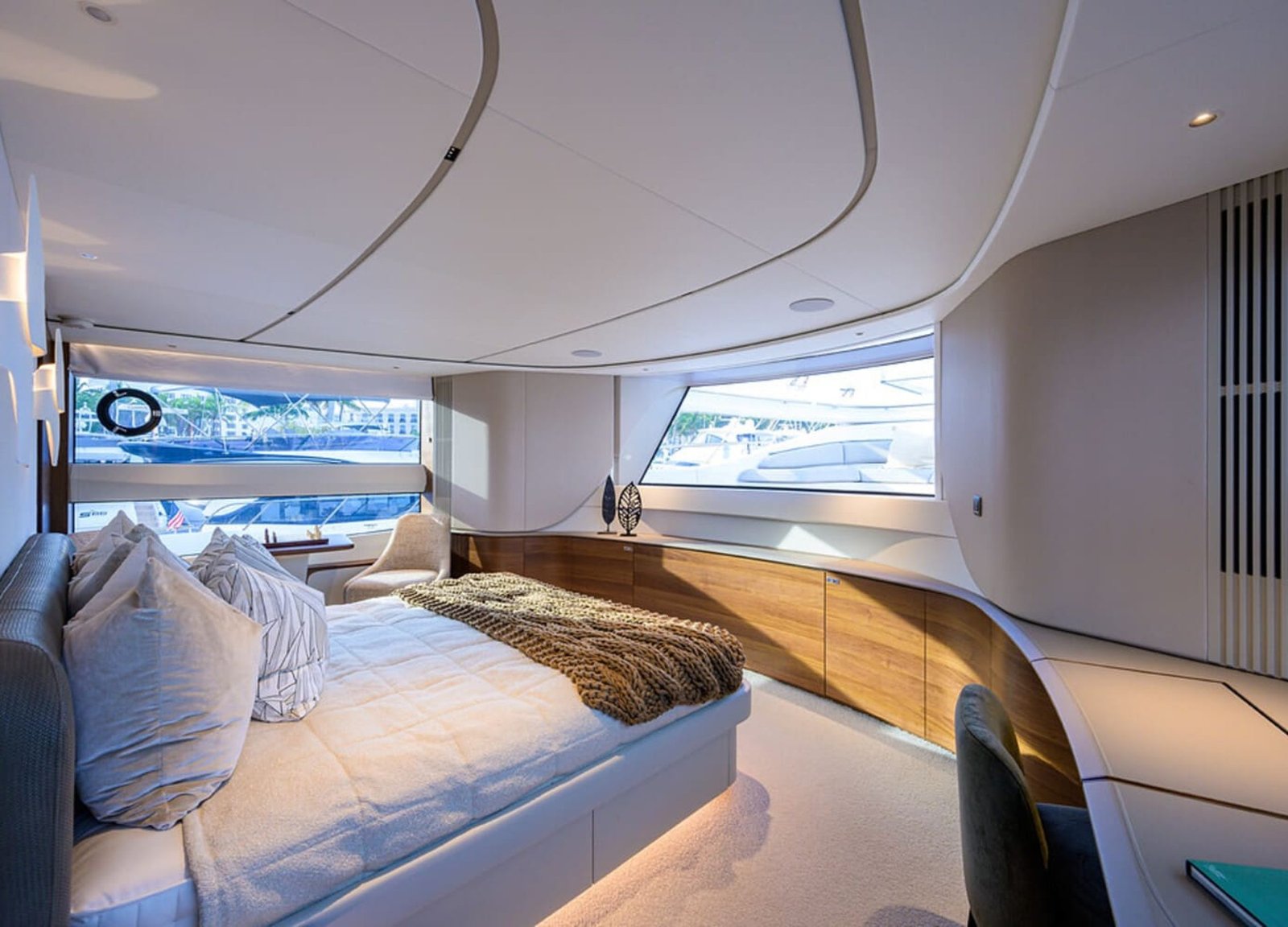 Another angle of the spacious and luxurious bedroom in the 100' PRINCESS X95 yacht, offering ultimate relaxation.