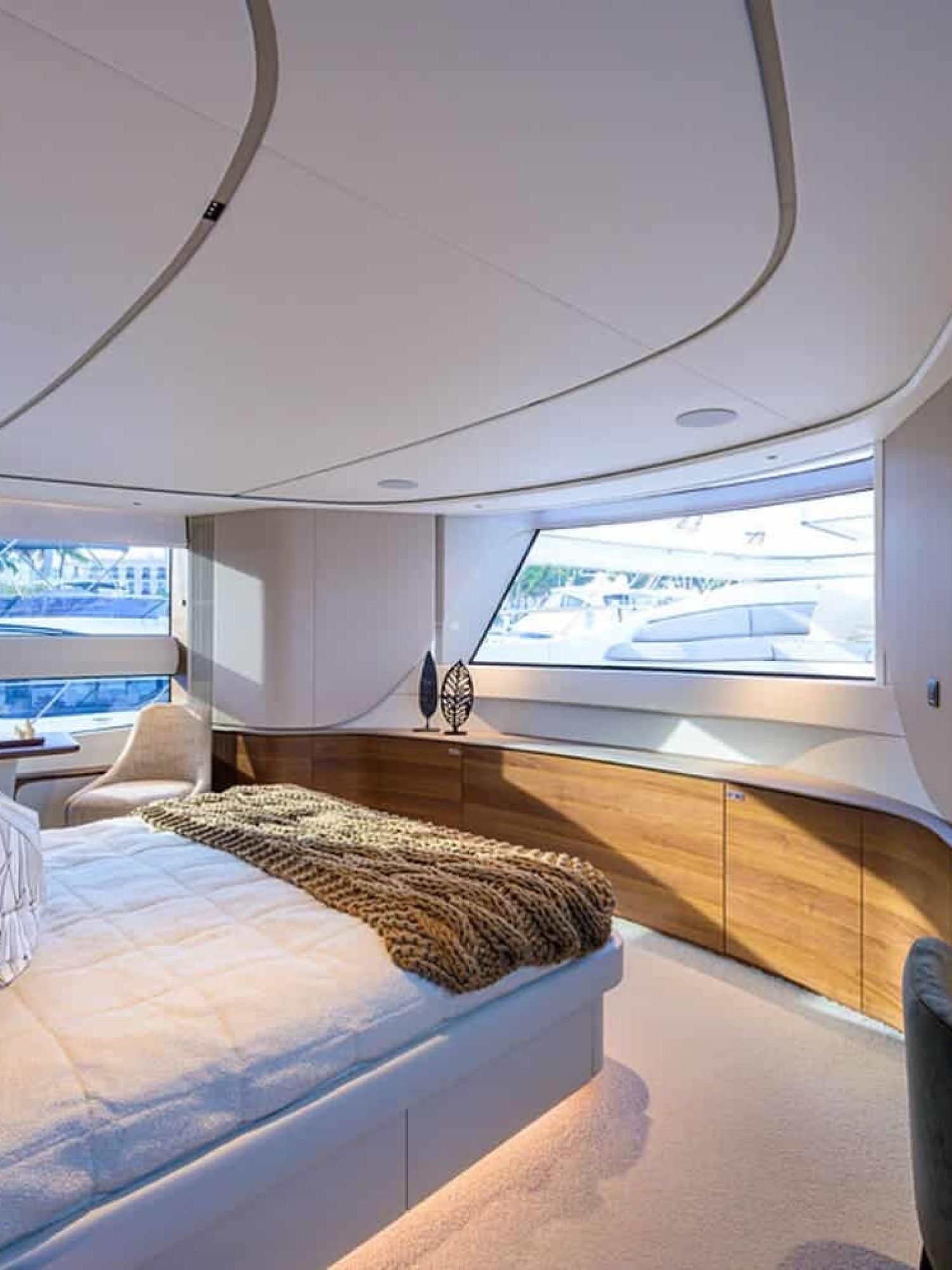 Another angle of the spacious and luxurious bedroom in the 100' PRINCESS X95 yacht, offering ultimate relaxation.