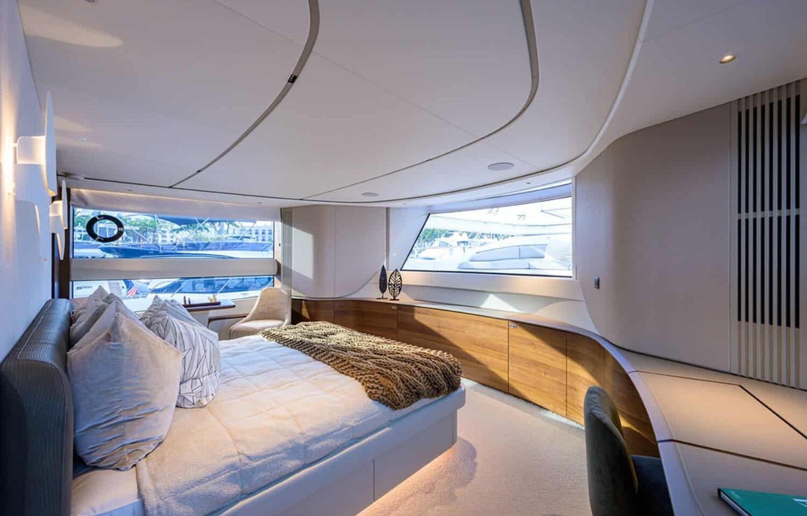 Another angle of the spacious and luxurious bedroom in the 100' PRINCESS X95 yacht, offering ultimate relaxation.