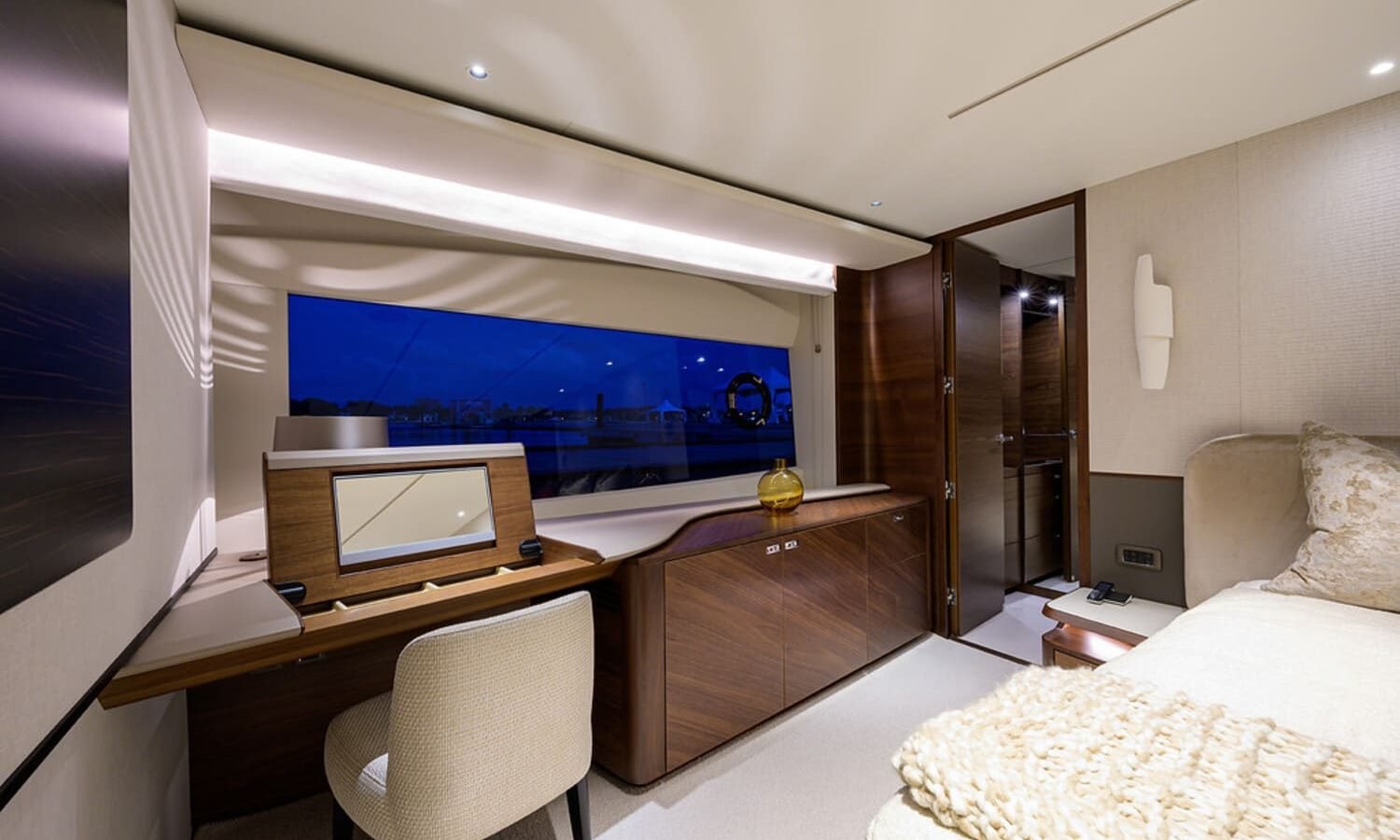 Stylish and comfortable seating area in one of the rooms on the 100' PRINCESS X95 yacht, perfect for relaxation.