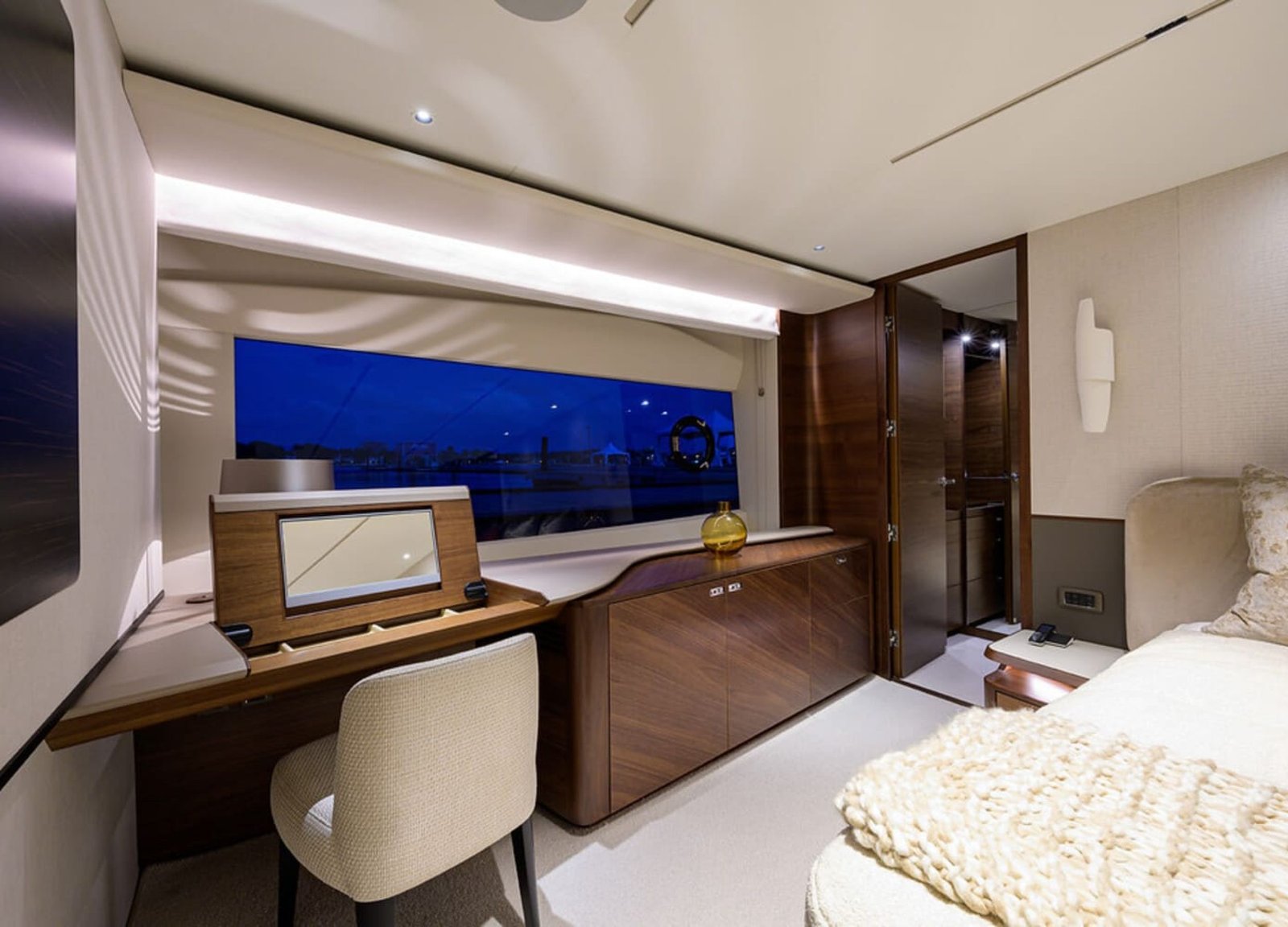 Stylish and comfortable seating area in one of the rooms on the 100' PRINCESS X95 yacht, perfect for relaxation.