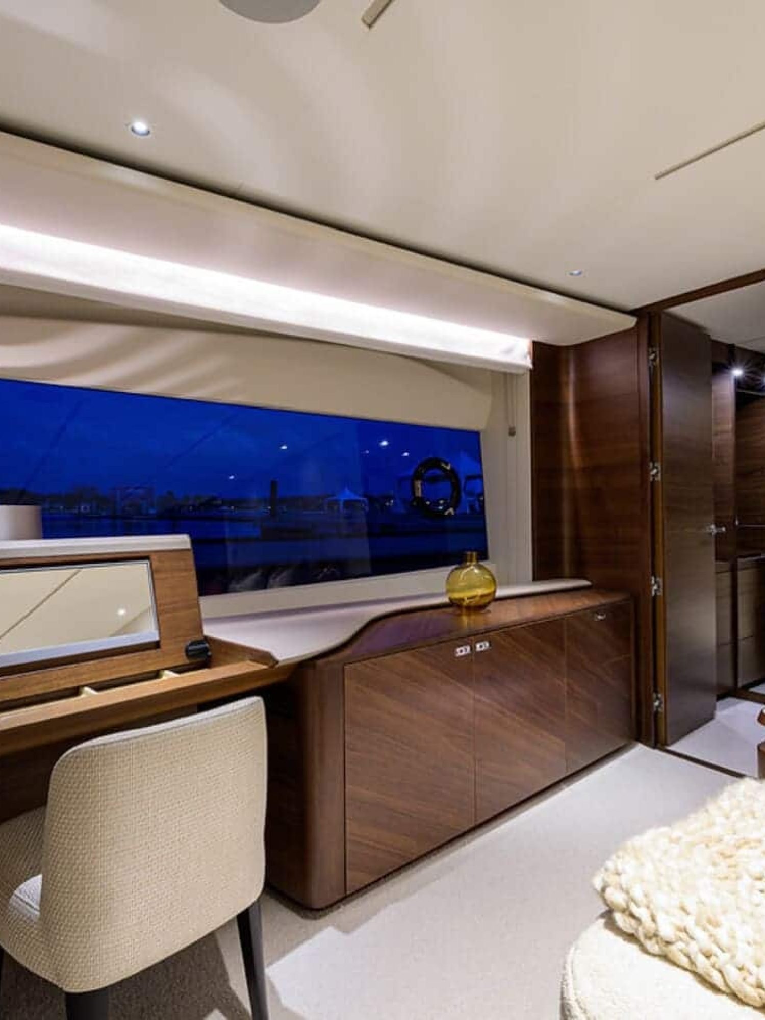 Stylish and comfortable seating area in one of the rooms on the 100' PRINCESS X95 yacht, perfect for relaxation.