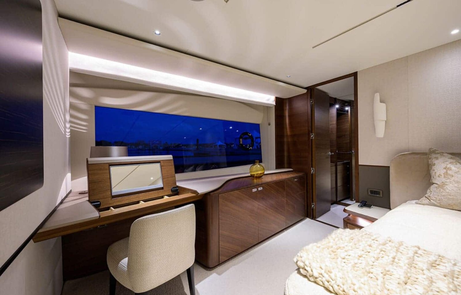 Stylish and comfortable seating area in one of the rooms on the 100' PRINCESS X95 yacht, perfect for relaxation.
