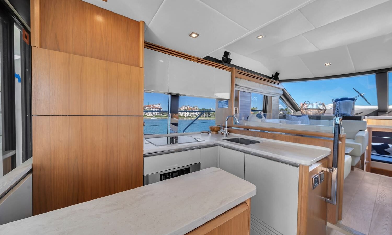 Modern kitchen onboard the 60' ABSOLUTE FLY yacht, featuring high-end appliances and a clean design.