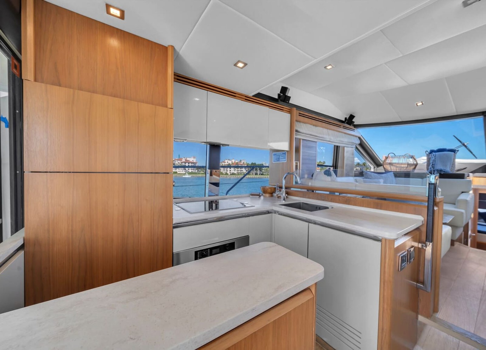 Modern kitchen onboard the 60' ABSOLUTE FLY yacht, featuring high-end appliances and a clean design.