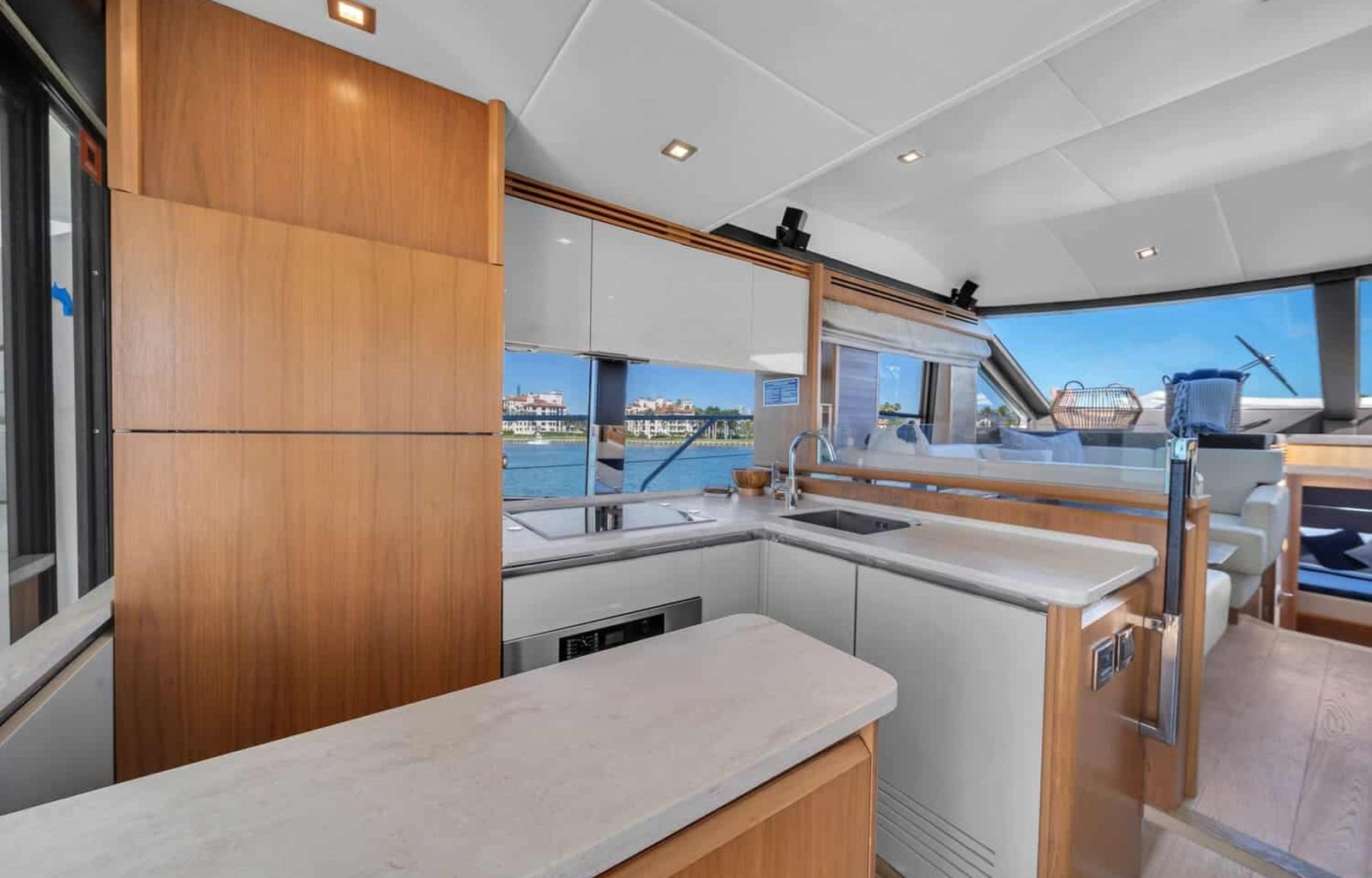 Modern kitchen onboard the 60' ABSOLUTE FLY yacht, featuring high-end appliances and a clean design.