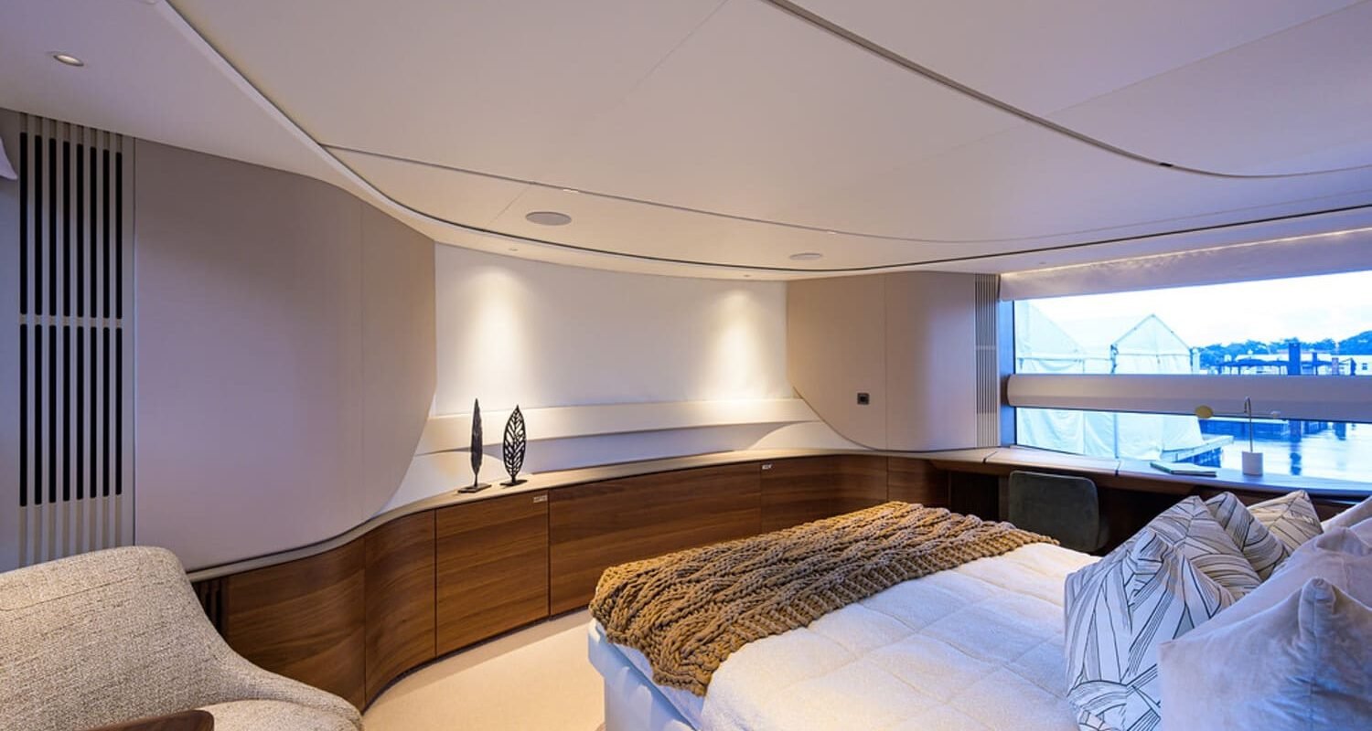 Luxurious and comfortable bedroom on the 100' PRINCESS X95 yacht, designed for total relaxation.