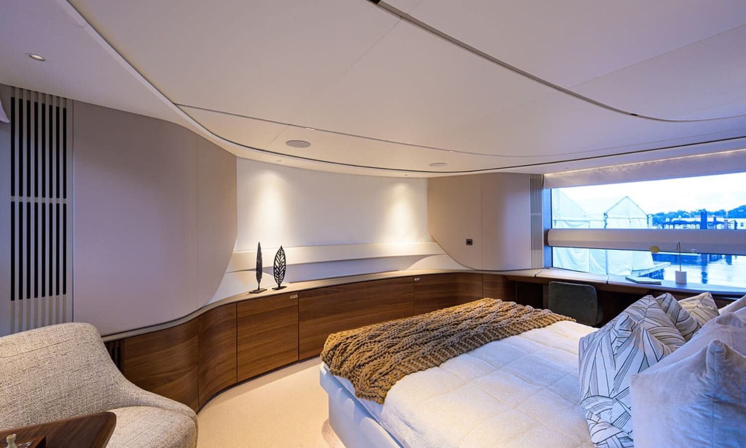 Luxurious and comfortable bedroom on the 100' PRINCESS X95 yacht, designed for total relaxation.