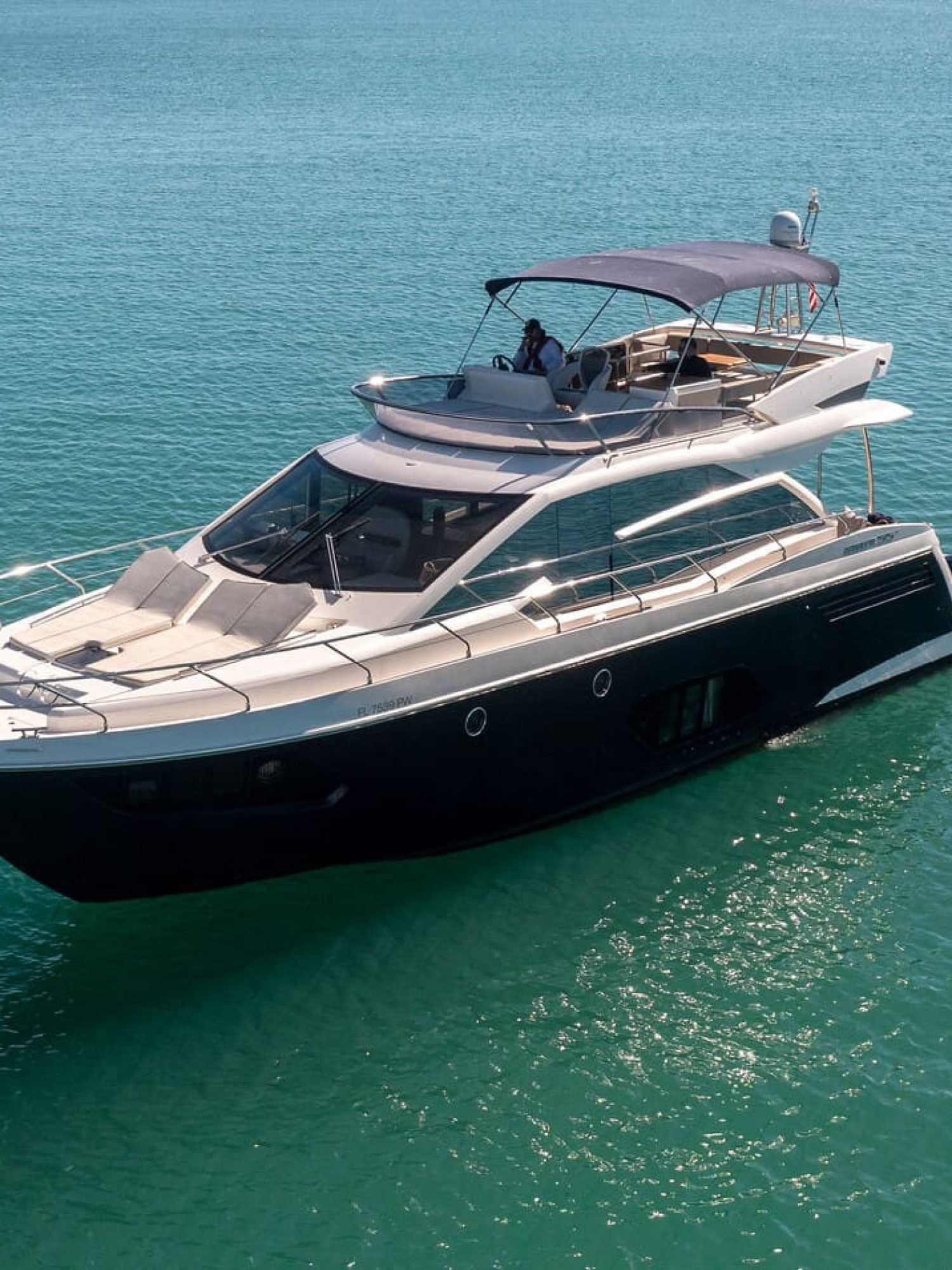 Stunning cover shot of the 60' ABSOLUTE FLY yacht, showcasing its sleek exterior and luxurious design.