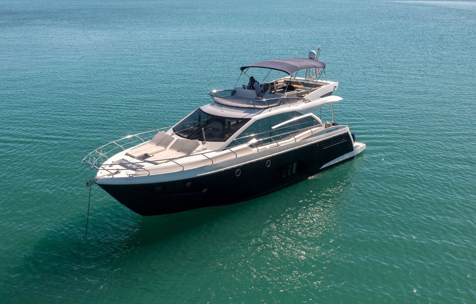Stunning cover shot of the 60' ABSOLUTE FLY yacht, showcasing its sleek exterior and luxurious design.