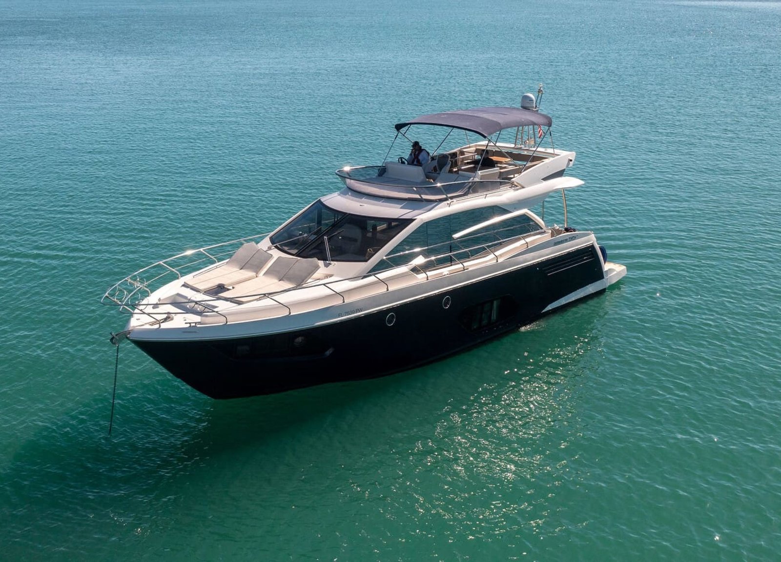 Stunning cover shot of the 60' ABSOLUTE FLY yacht, showcasing its sleek exterior and luxurious design.