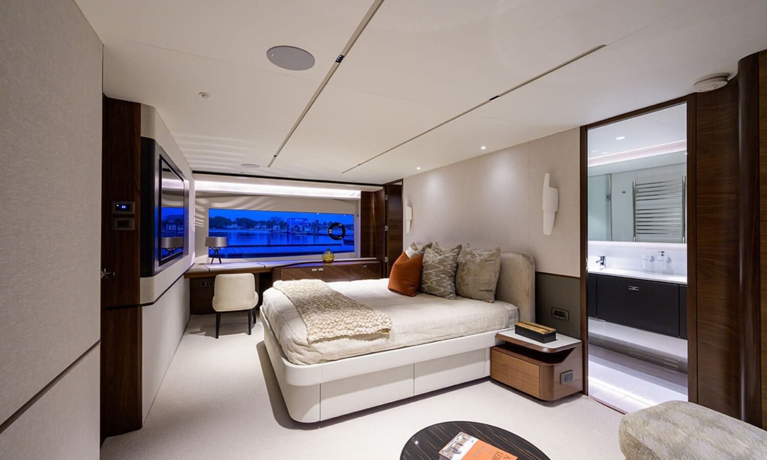 Elegant and comfortable bedroom on the 100' PRINCESS X95 yacht, offering a relaxing space at sea.