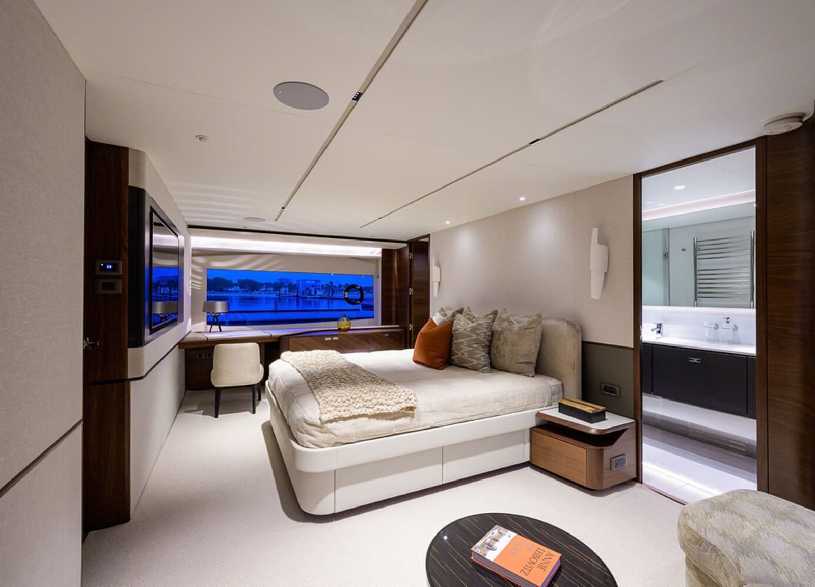 Elegant and comfortable bedroom on the 100' PRINCESS X95 yacht, offering a relaxing space at sea.