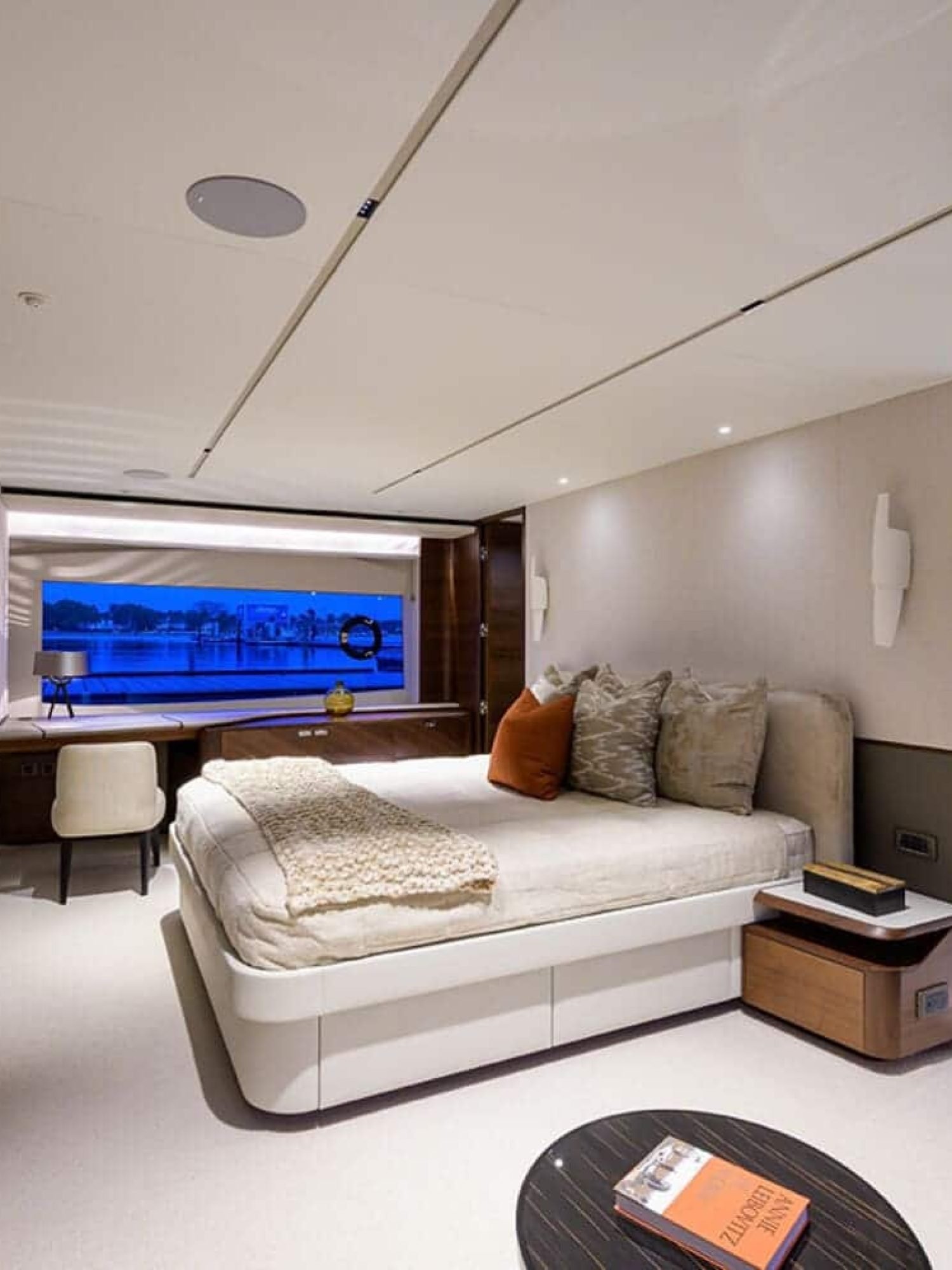 Elegant and comfortable bedroom on the 100' PRINCESS X95 yacht, offering a relaxing space at sea.