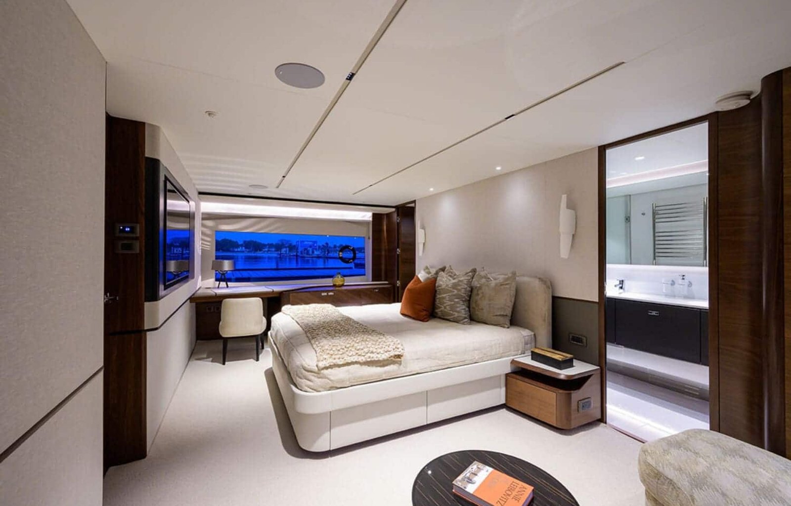 Elegant and comfortable bedroom on the 100' PRINCESS X95 yacht, offering a relaxing space at sea.